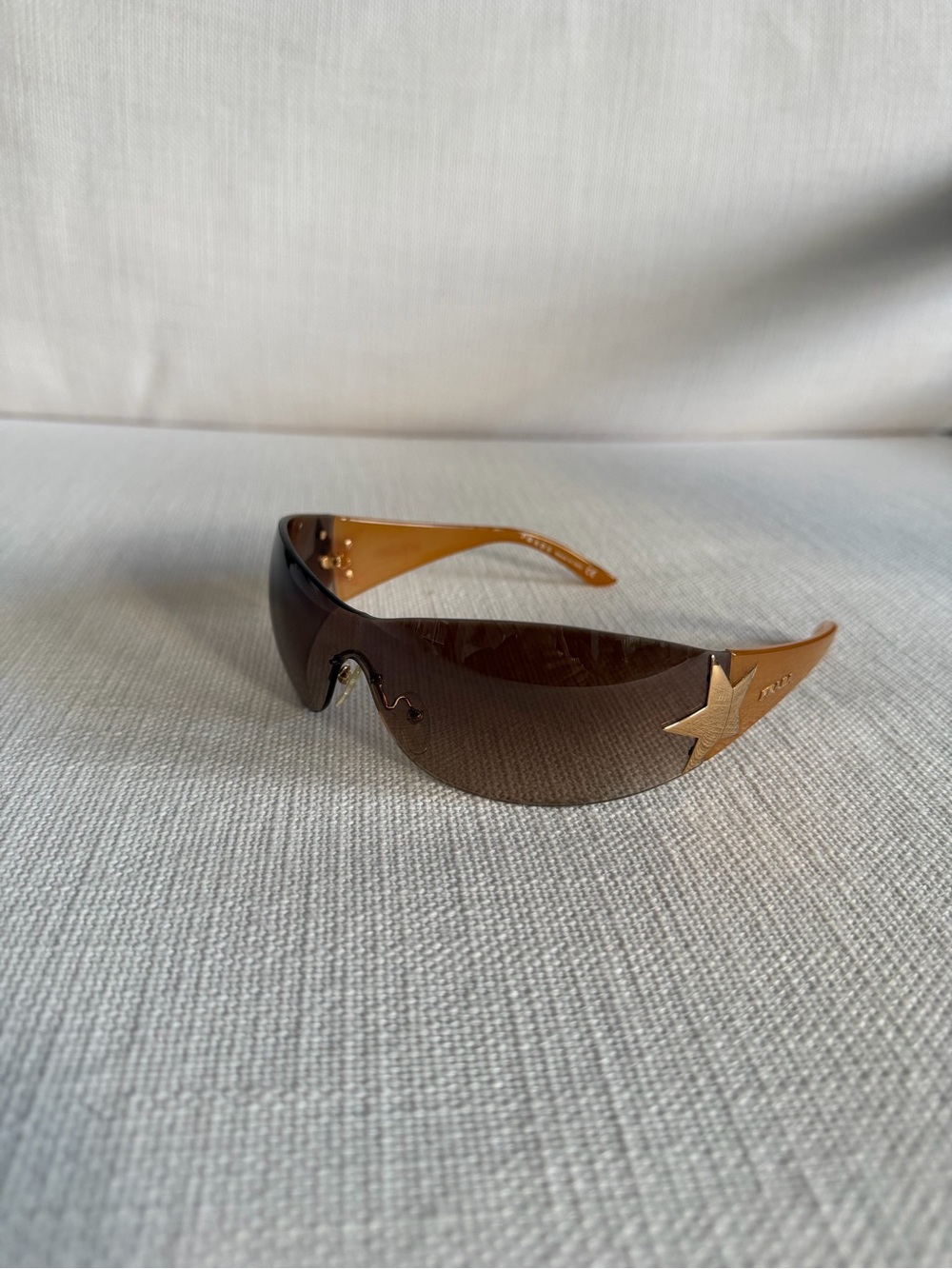 Prada Brown Shield Sunglasses with Gold Star Accents